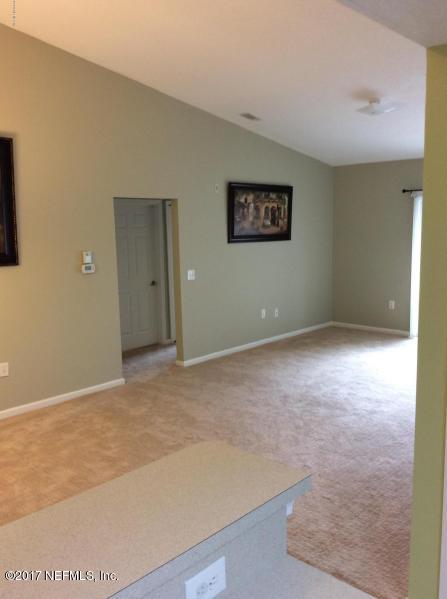 7920 Merrill Road, Unit 1009 Jacksonville, FL 32277 - Photo 4 of 22 an empty room with an entryway