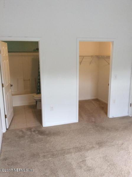 7920 Merrill Road, Unit 1009 Jacksonville, FL 32277 - Photo 7 of 22 an empty room with windows