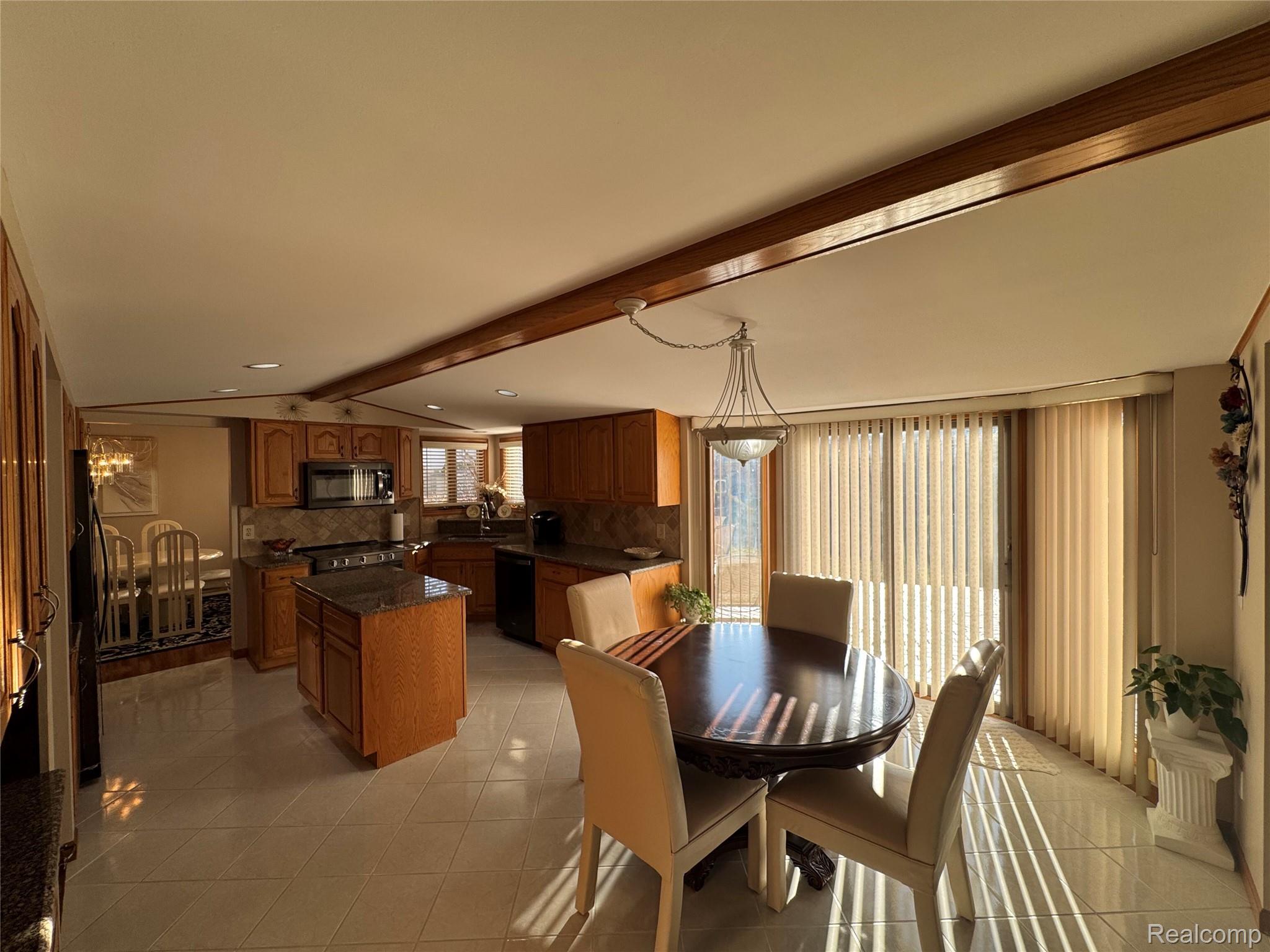 48583 Tilch Road Macomb, MI 48044 - Photo 15 of 53 Dining area with lofted ceiling with beams, light tile patterned flooring, and recessed lighting