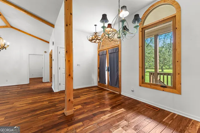 a view of front door with wooden floor