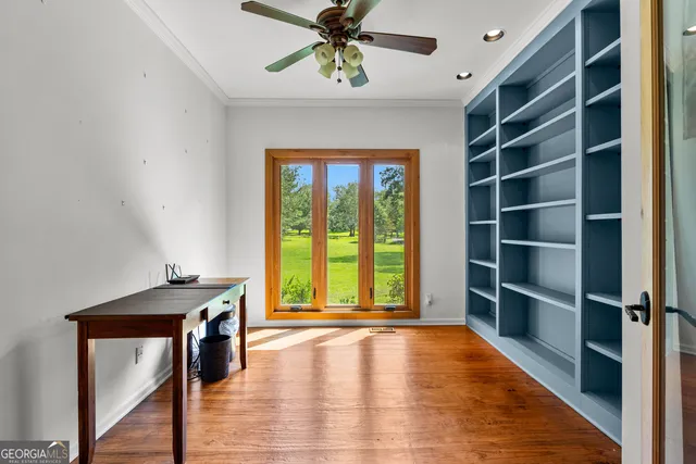 a bathroom with a granite countertop sink a mirror a vanity and a bathtub