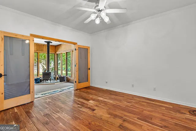 a view of a room with wooden floor