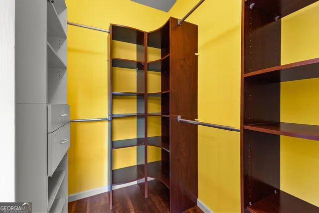 a kitchen with stainless steel appliances granite countertop a stove a sink and a chandelier