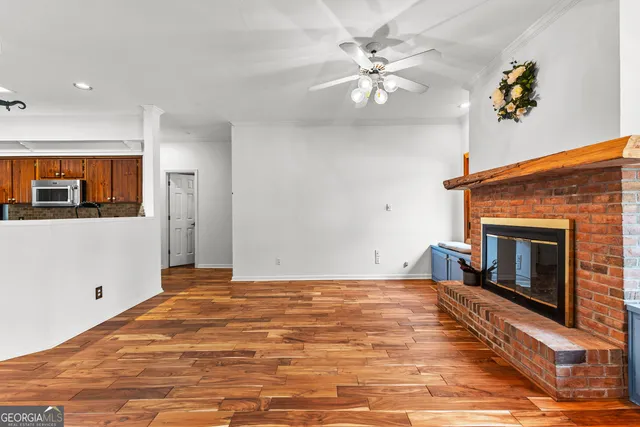 a kitchen with granite countertop a refrigerator stove and cabinets