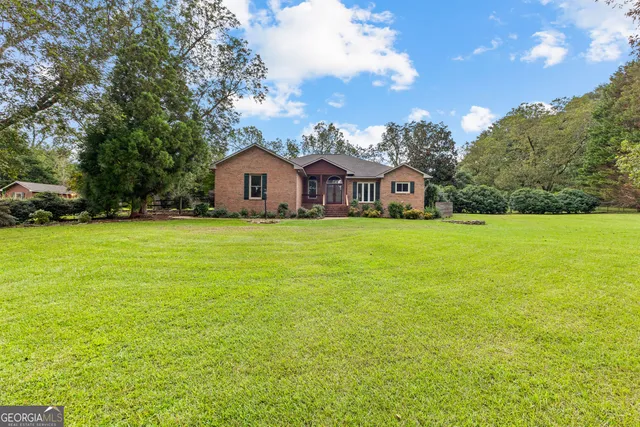 a view of a big yard with an trees