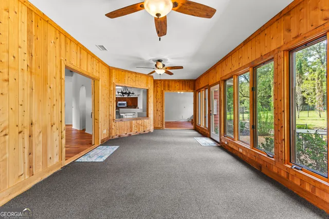 a bathroom with a bathtub and window