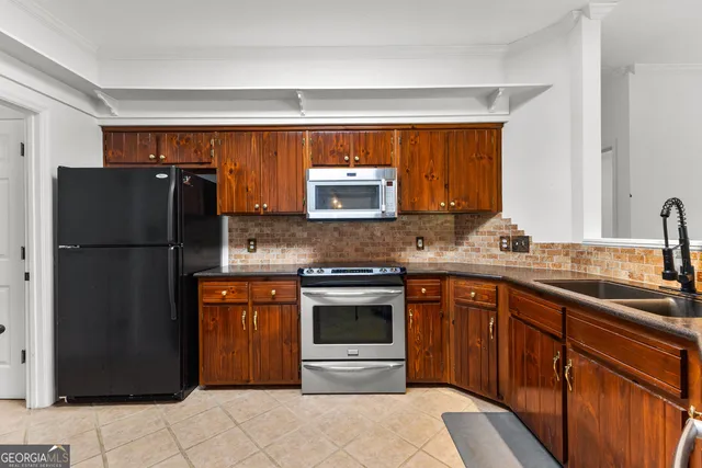 a view of a chairs and table in the patio