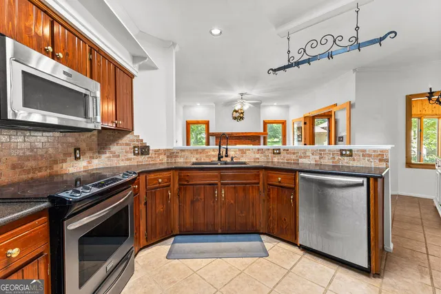 a view of a chairs and table on the wooden floor
