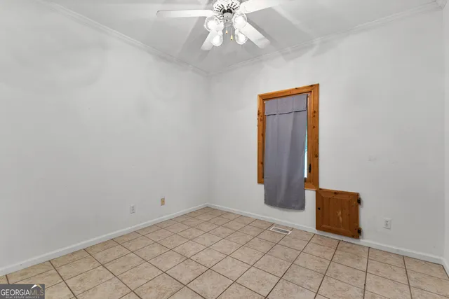 a view of a swimming pool with a patio and a yard