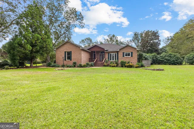 a view of a room with wooden floor and chandelier
