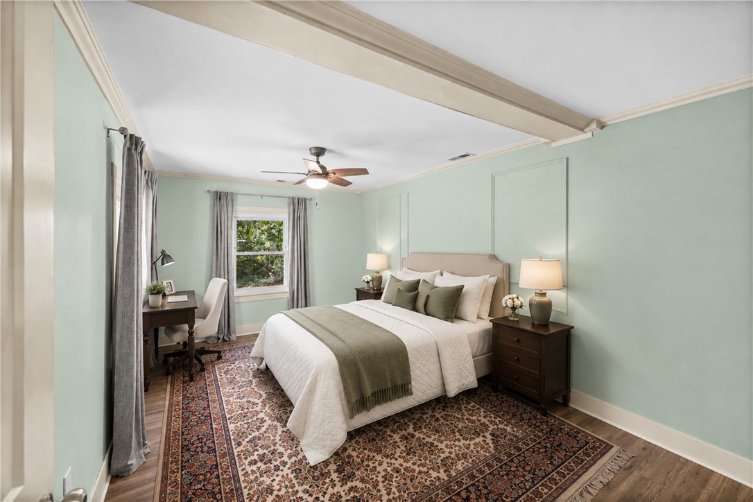 203 Muller Road Walhalla, SC 29691 - Photo 15 of 34 Elegant crown molding and classic wall paneling frame this spacious bedroom retreat.