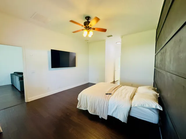 a bedroom with a bed and a window