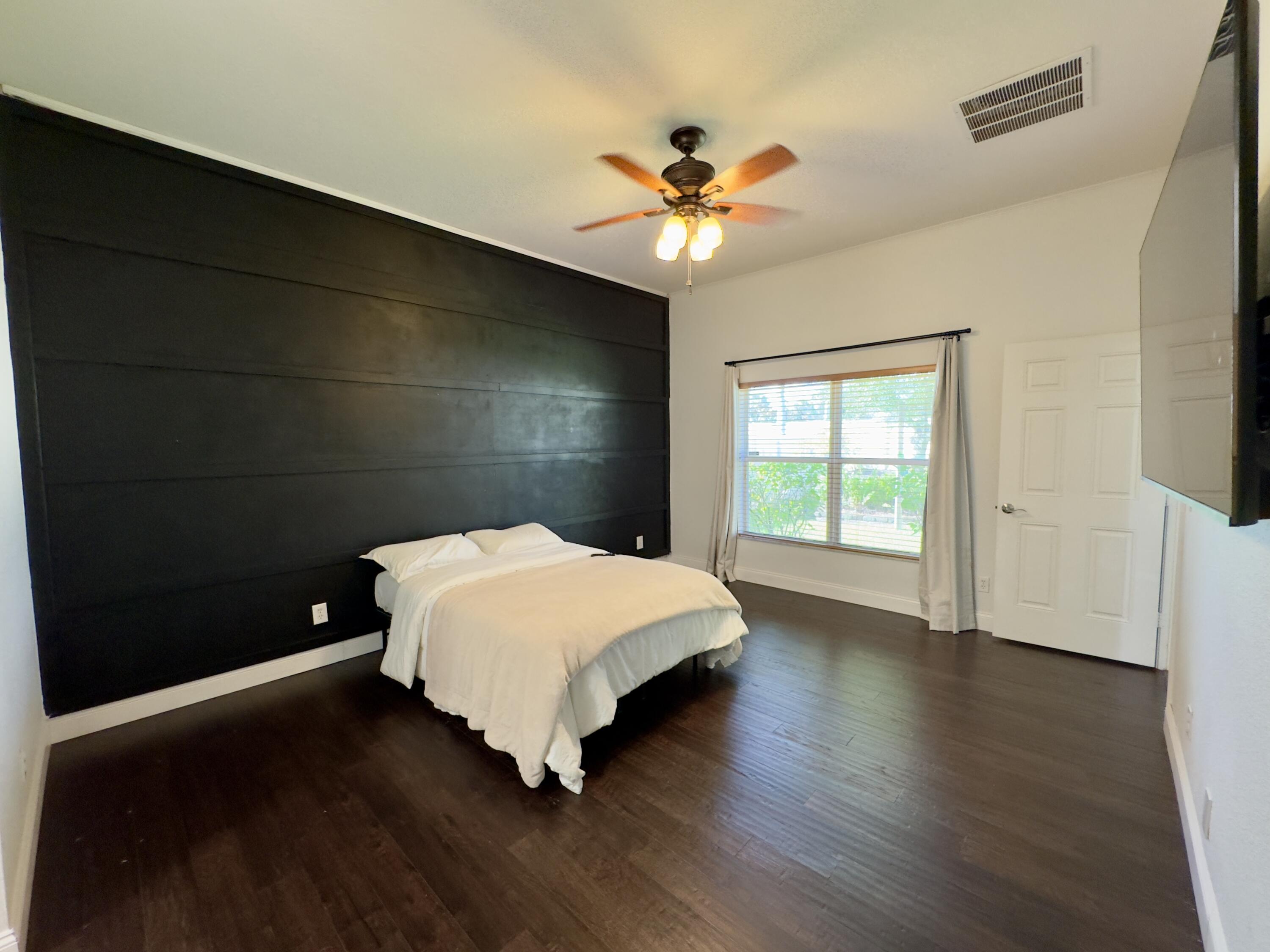 11479 Southwest Glengarry Court Port St. Lucie, FL 34987 - Photo 17 of 24 a bedroom with a bed and a window