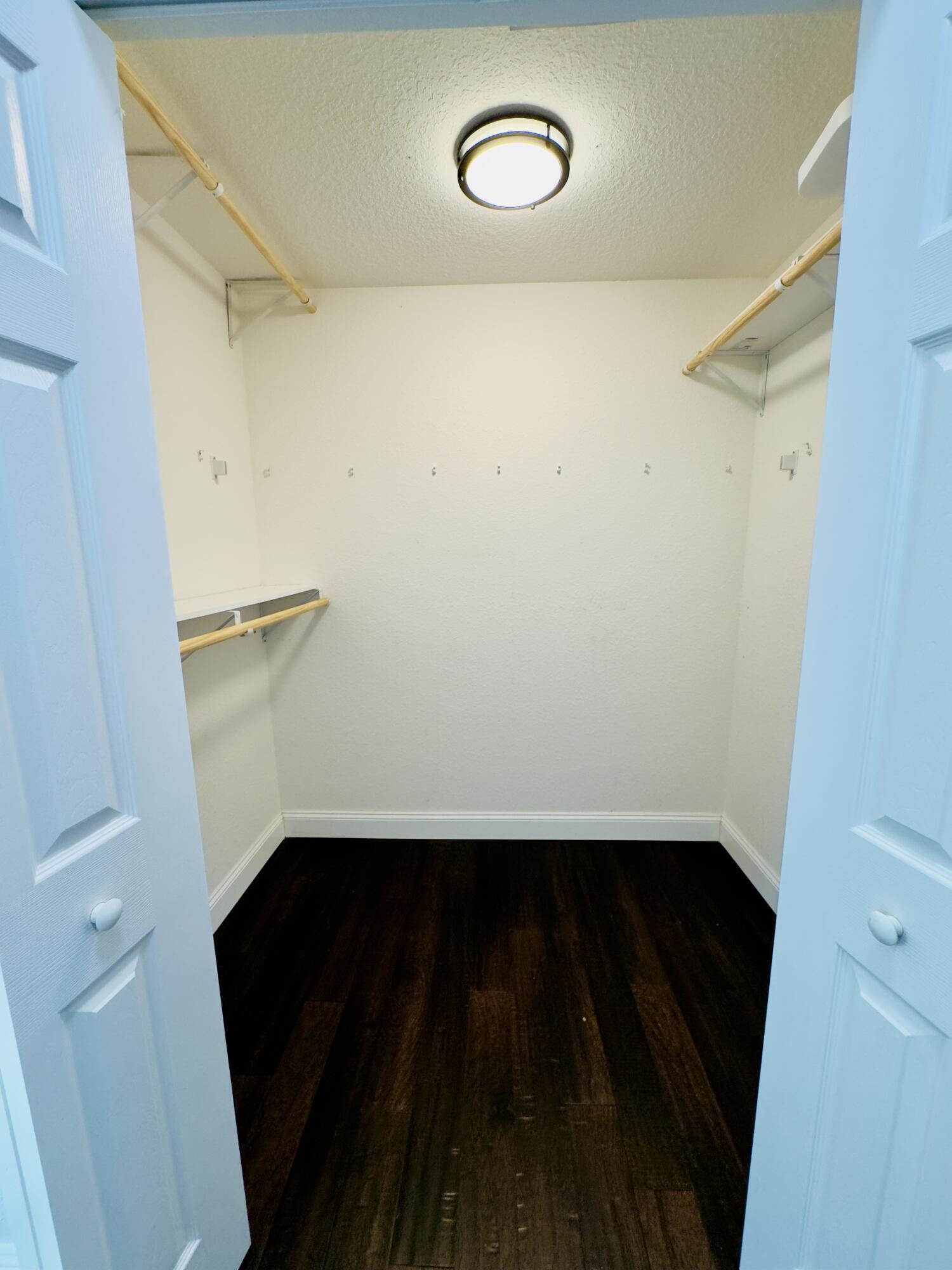 11479 Southwest Glengarry Court Port St. Lucie, FL 34987 - Photo 19 of 24 a view of storage and utility room with wooden floor