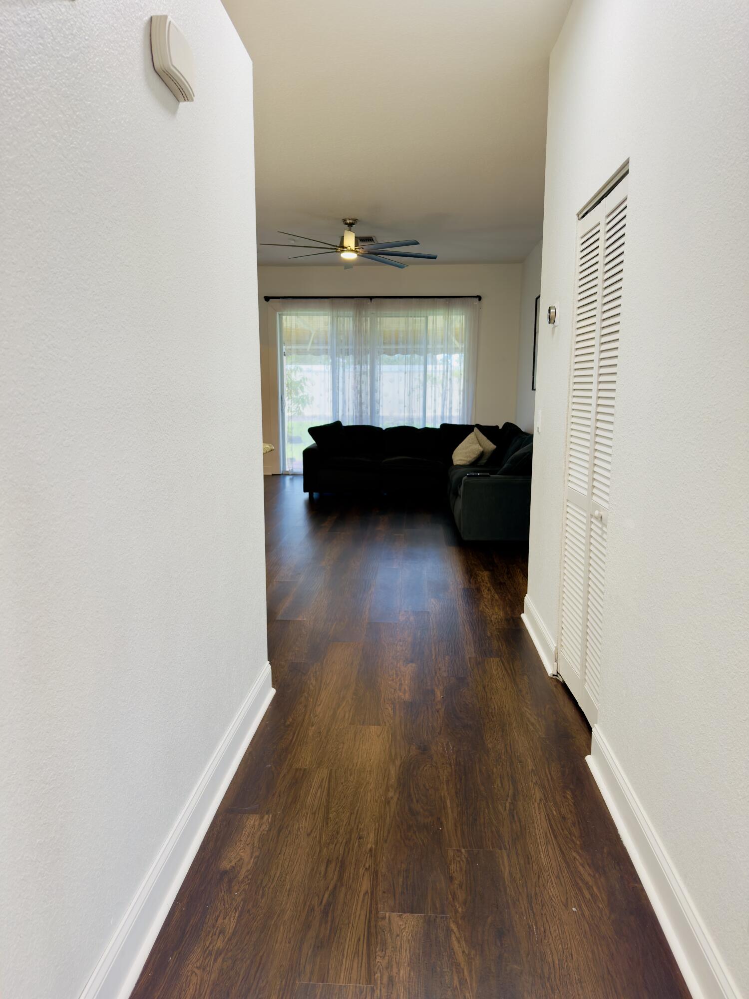 11479 Southwest Glengarry Court Port St. Lucie, FL 34987 - Photo 5 of 24 a view of a room with wooden floor and a window