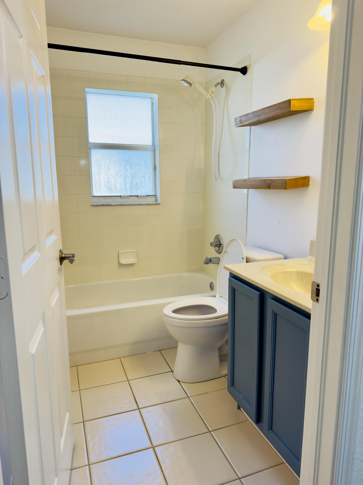 11479 Southwest Glengarry Court Port St. Lucie, FL 34987 - Photo 9 of 24 a bathroom with a sink a toilet and shower