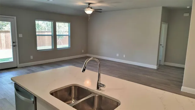 a stove top oven sitting inside of a kitchen