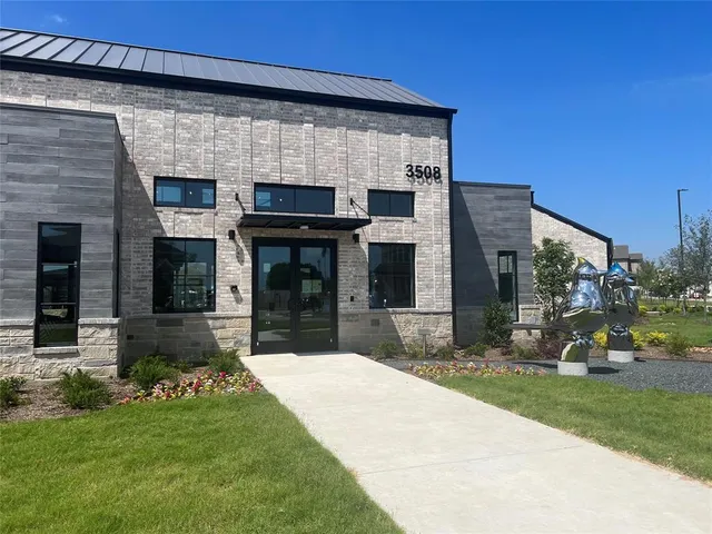 a large kitchen with a table and chairs