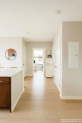 a view of a kitchen cabinets and wooden floor