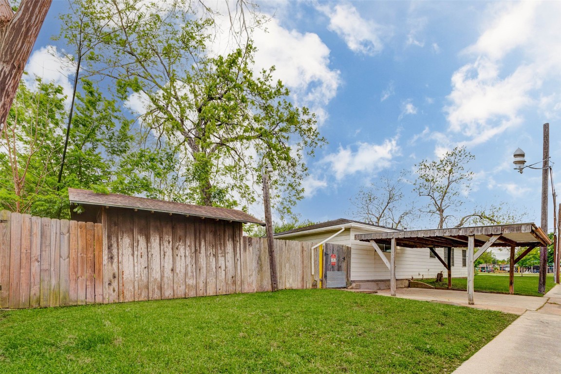 411 Burke Road Pasadena, TX 77506 - Photo 22 of 24 front of house with covered carport