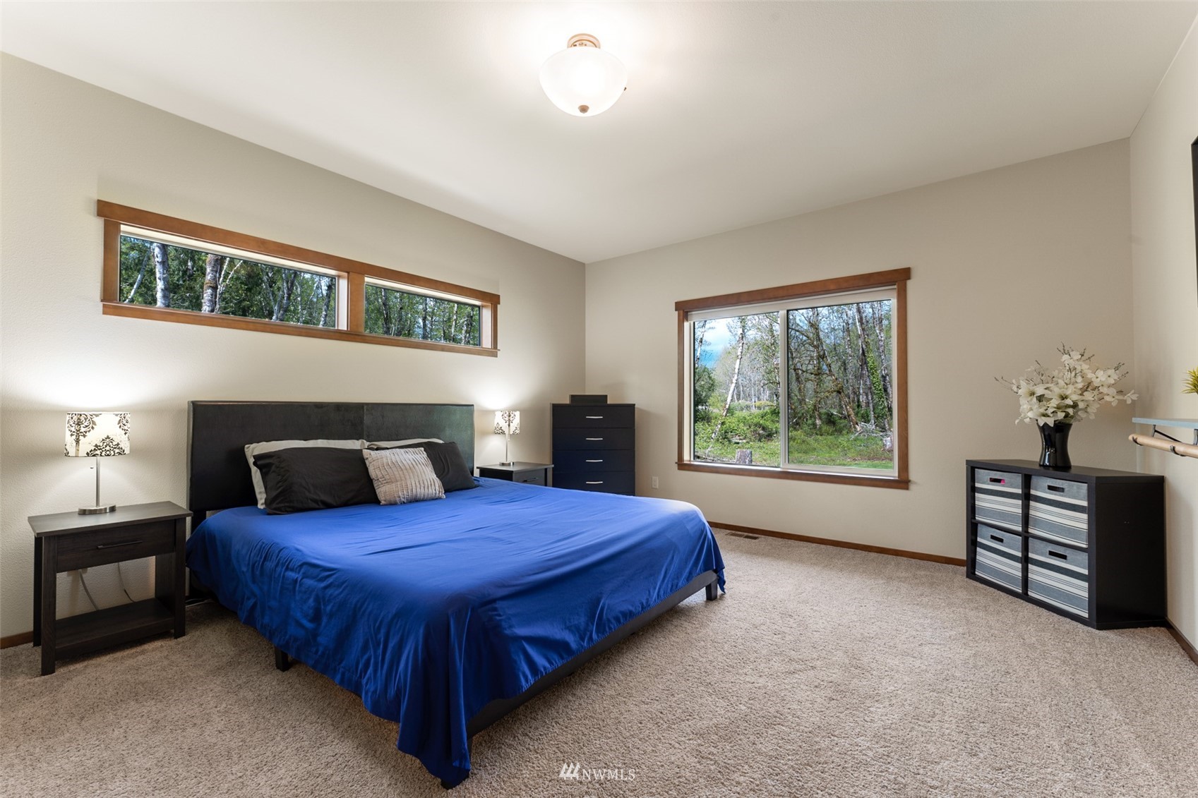 81 East Lighthouse Road Shelton, WA 98584 - Photo 11 of 28 a spacious bedroom with a bed and a window