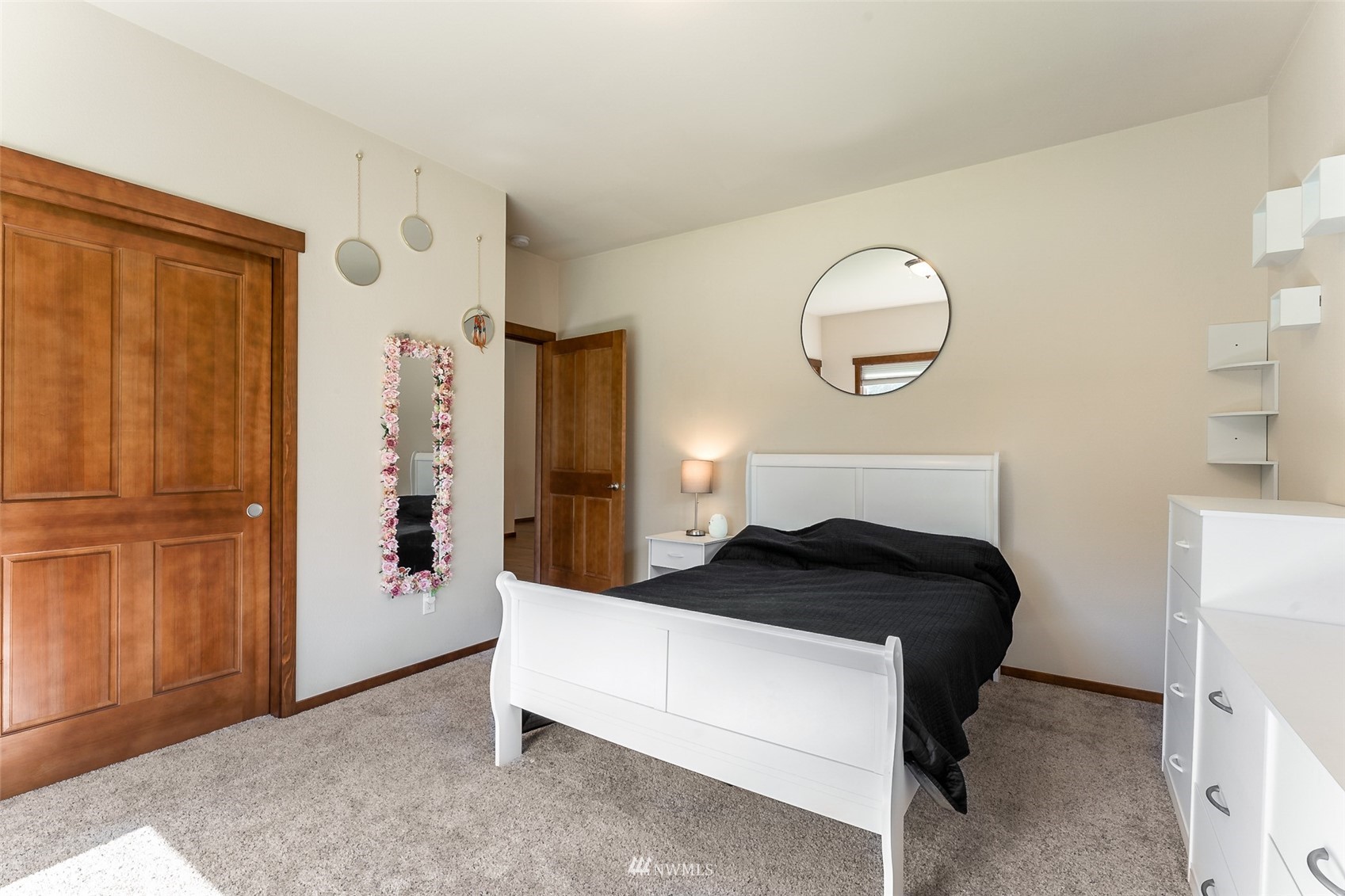 81 East Lighthouse Road Shelton, WA 98584 - Photo 15 of 28 a bedroom with a bed and wooden floor