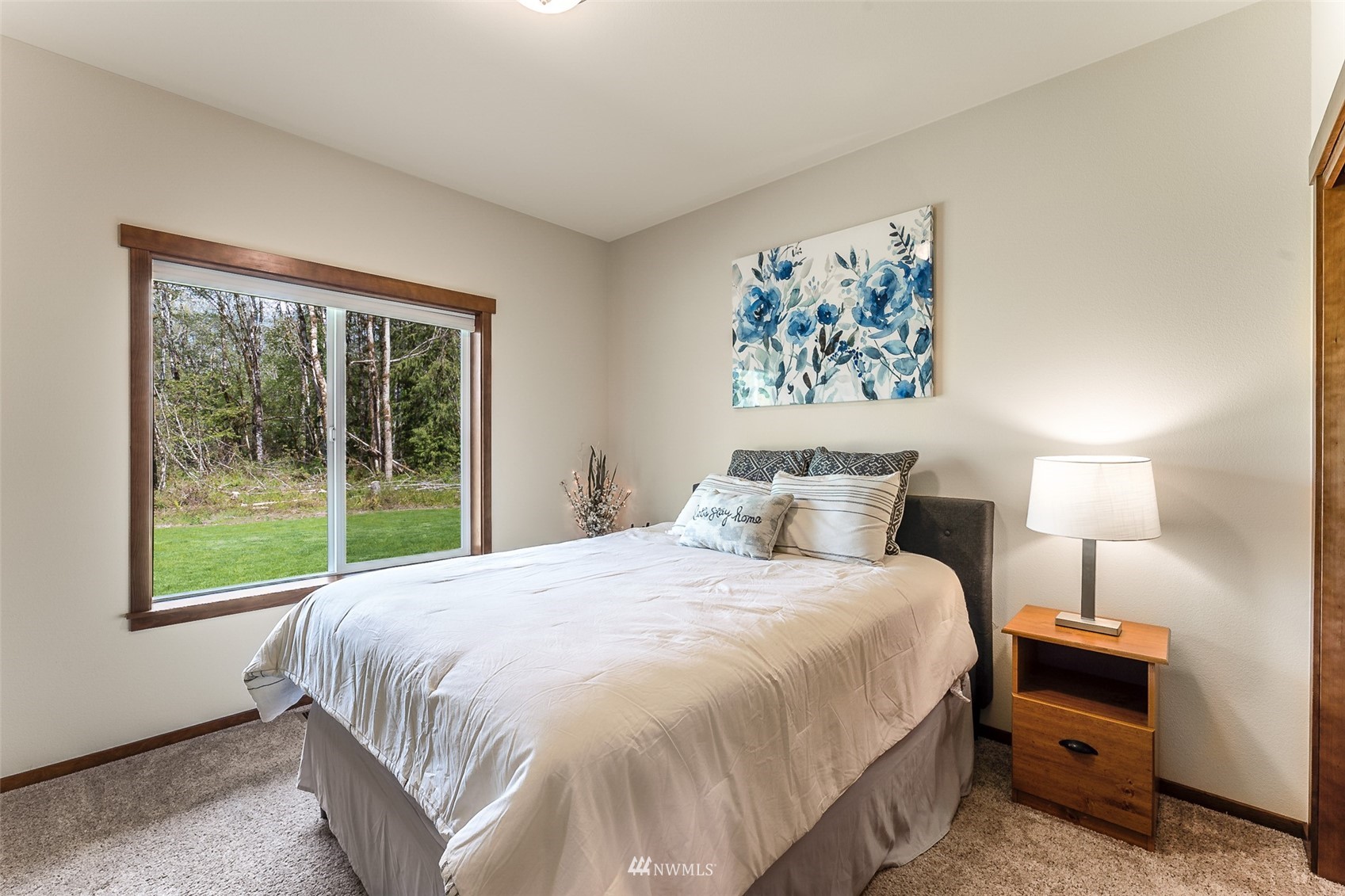 81 East Lighthouse Road Shelton, WA 98584 - Photo 16 of 28 a bedroom with a bed and a large window