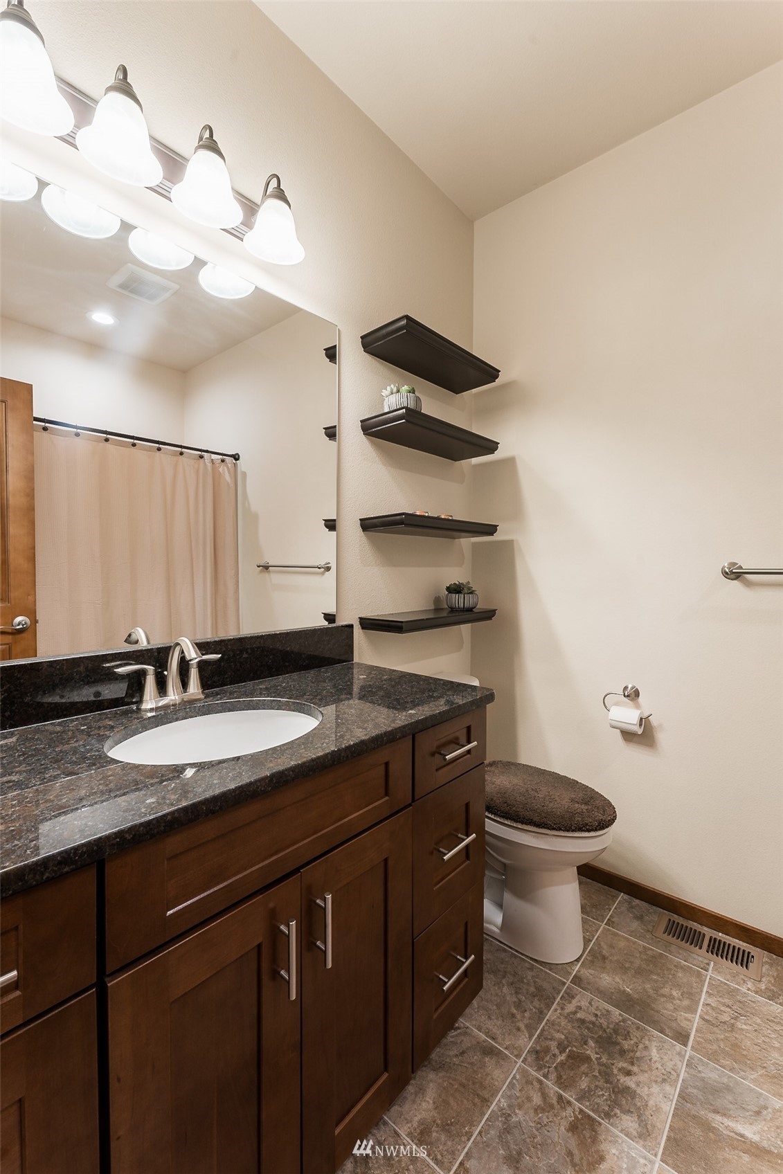 81 East Lighthouse Road Shelton, WA 98584 - Photo 17 of 28 a bathroom with a granite countertop sink a toilet and a mirror
