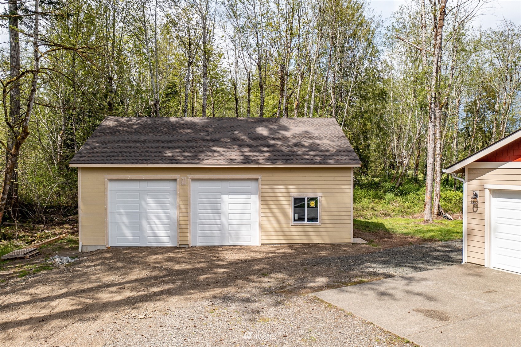 81 East Lighthouse Road Shelton, WA 98584 - Photo 23 of 28 a front view of a house with a yard and garage