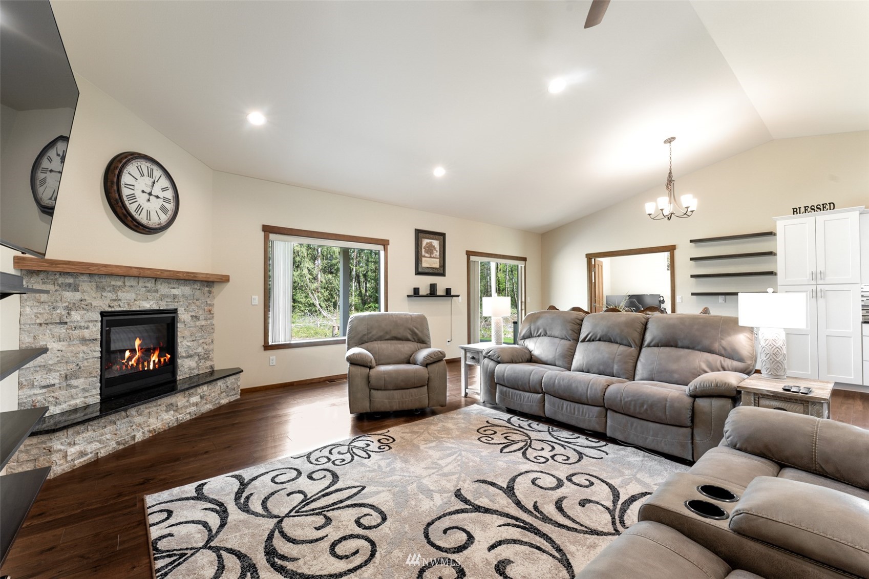 81 East Lighthouse Road Shelton, WA 98584 - Photo 5 of 28 a living room with furniture a large window and a fireplace