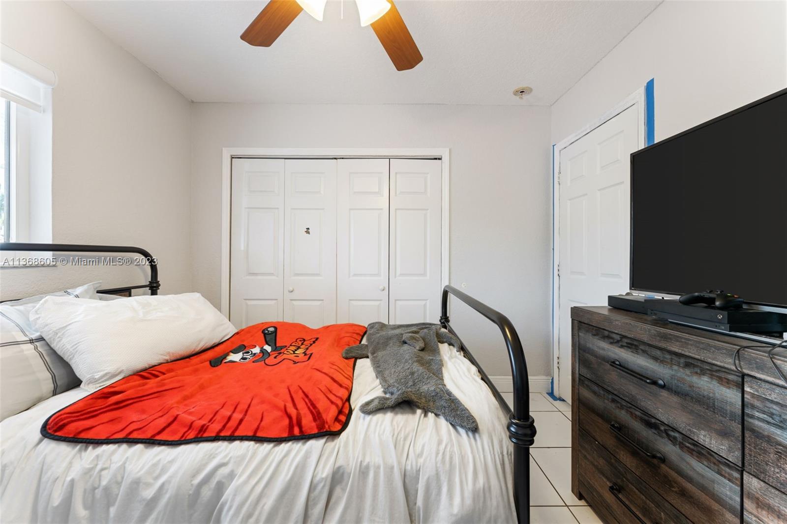 Hialeah Hialeah, FL 33014 - Photo 16 of 32 a bedroom with bed and a flat screen tv