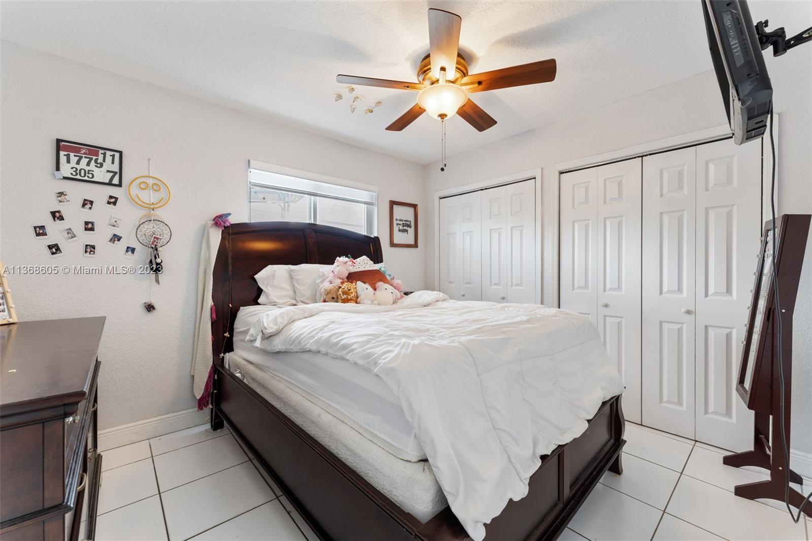 Hialeah Hialeah, FL 33014 - Photo 23 of 32 a bed sitting in a bedroom next to a window