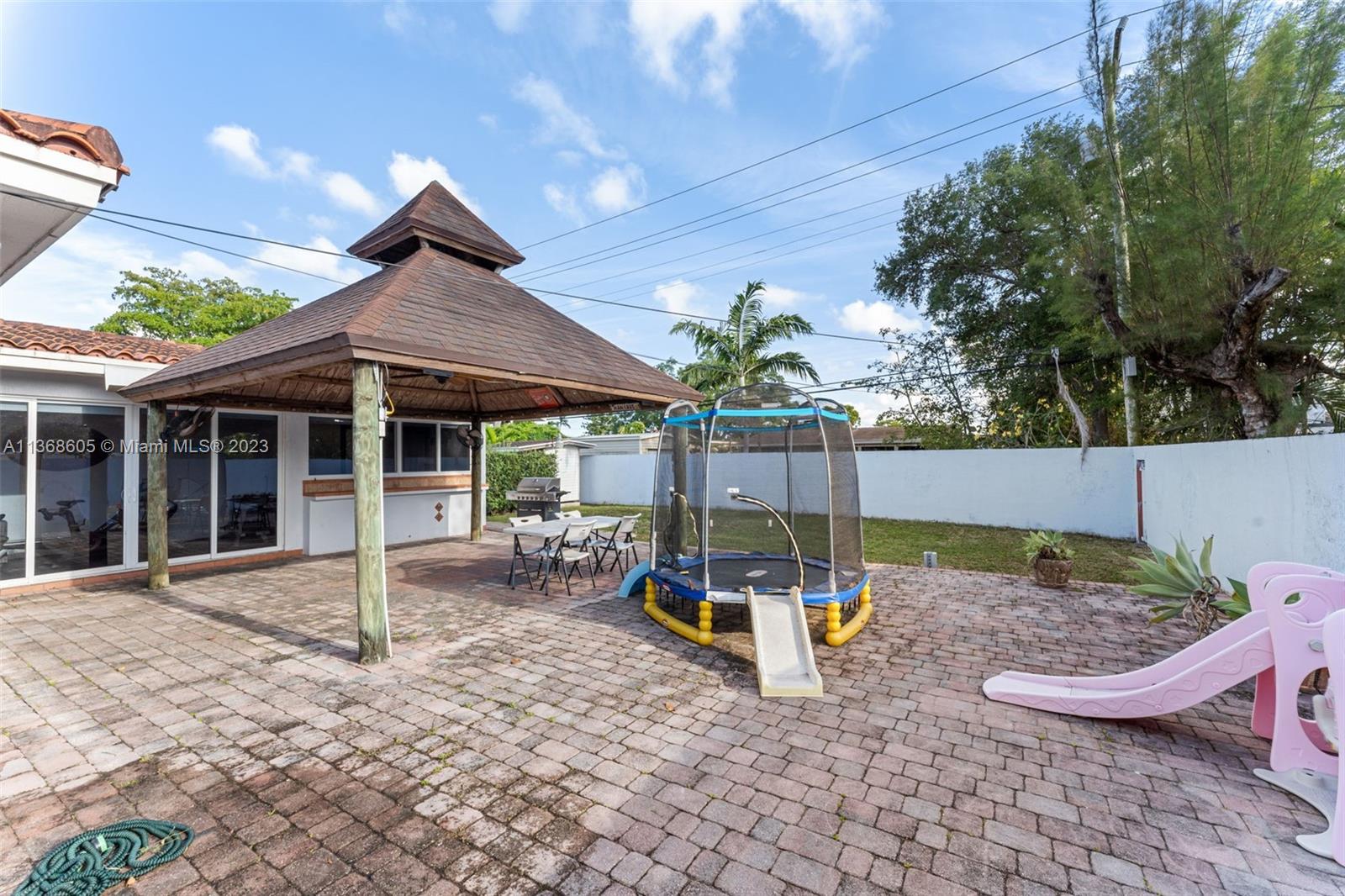 Hialeah Hialeah, FL 33014 - Photo 30 of 32 a backyard of a house with outdoor seating