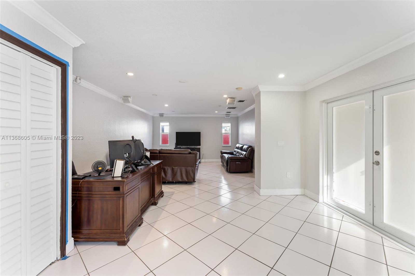 Hialeah Hialeah, FL 33014 - Photo 5 of 32 a living room with furniture and a flat screen tv