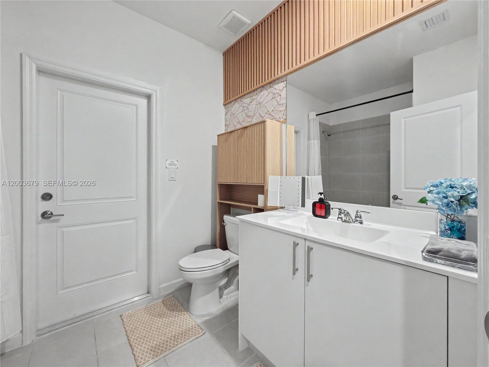 13218 Southwest 189th Terrace Miami, FL 33177 - Photo 12 of 47 a bathroom with a sink toilet and shower