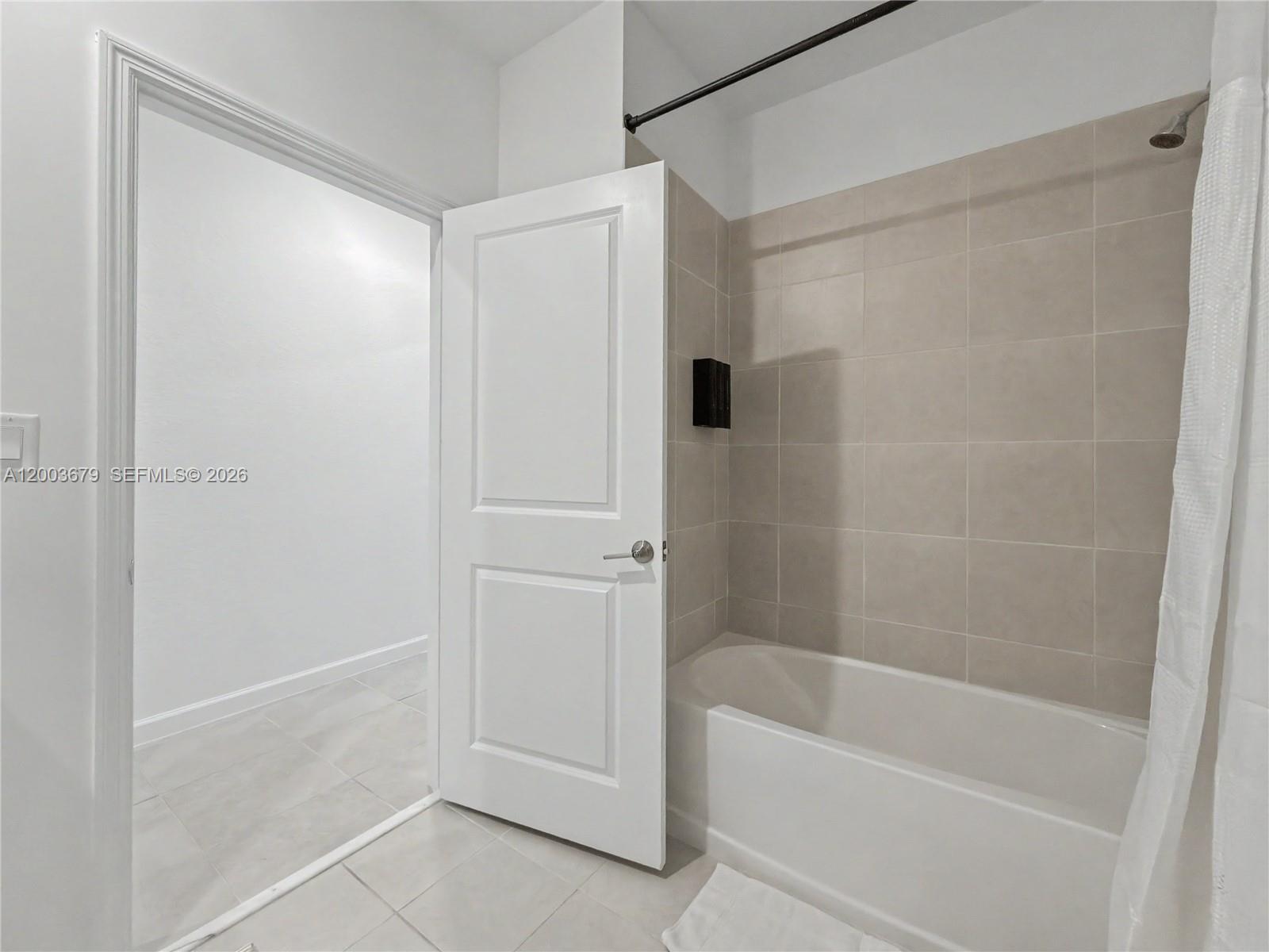 13218 Southwest 189th Terrace Miami, FL 33177 - Photo 13 of 47 a bathroom with a bathtub and a shower