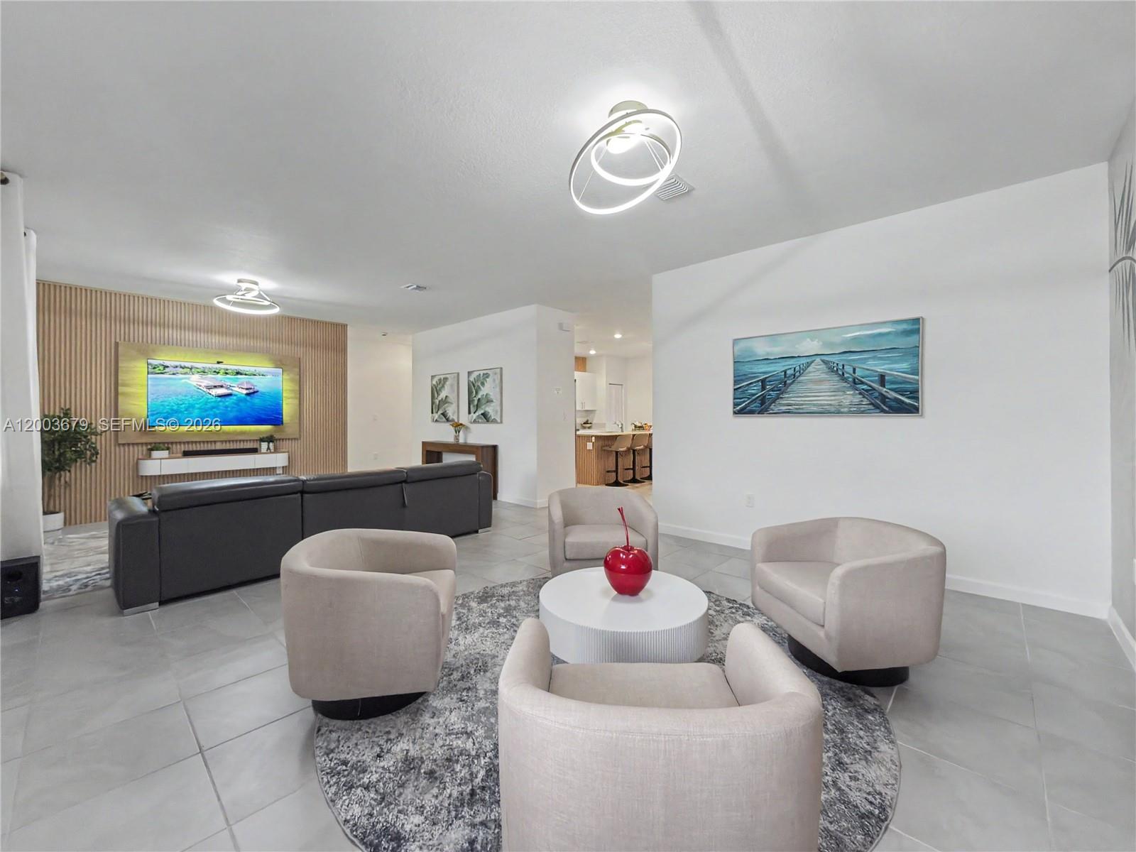 13218 Southwest 189th Terrace Miami, FL 33177 - Photo 15 of 47 a living room with furniture and a flat screen tv