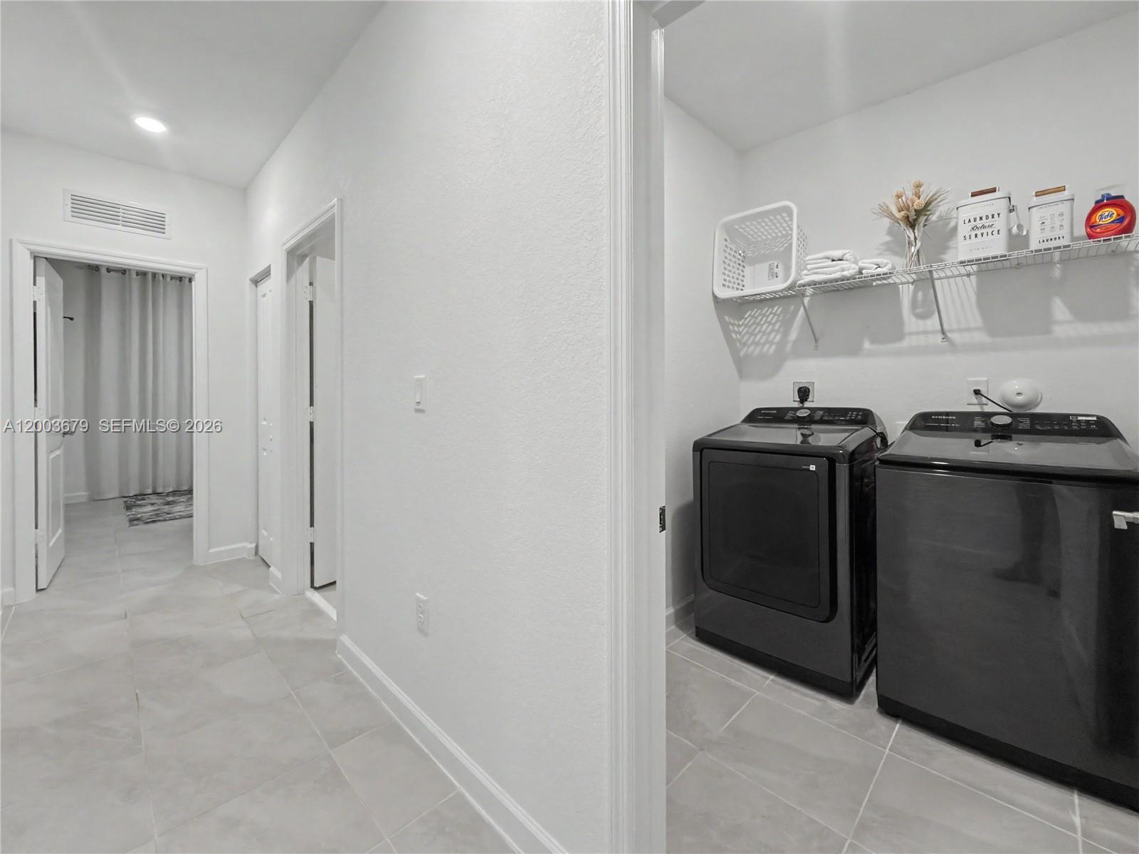 13218 Southwest 189th Terrace Miami, FL 33177 - Photo 19 of 47 a view of a storage & utility room with racks on the wall