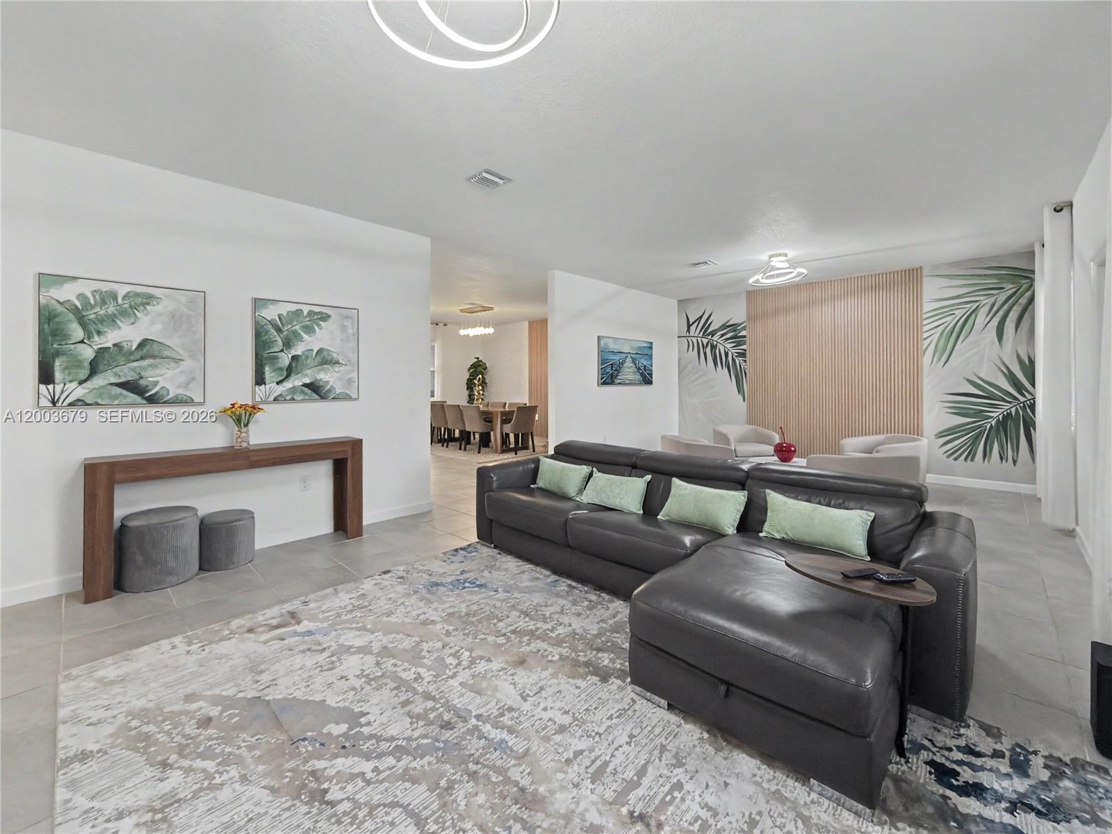 13218 Southwest 189th Terrace Miami, FL 33177 - Photo 20 of 47 a living room with furniture and a fireplace