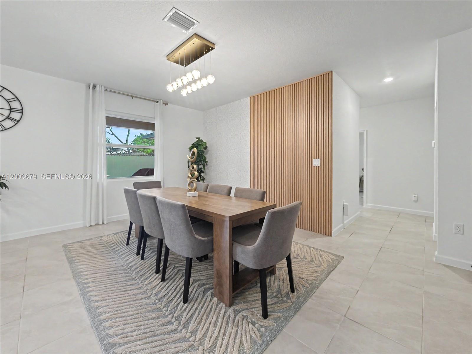 13218 Southwest 189th Terrace Miami, FL 33177 - Photo 21 of 47 a view of a dining room with a table and chairs