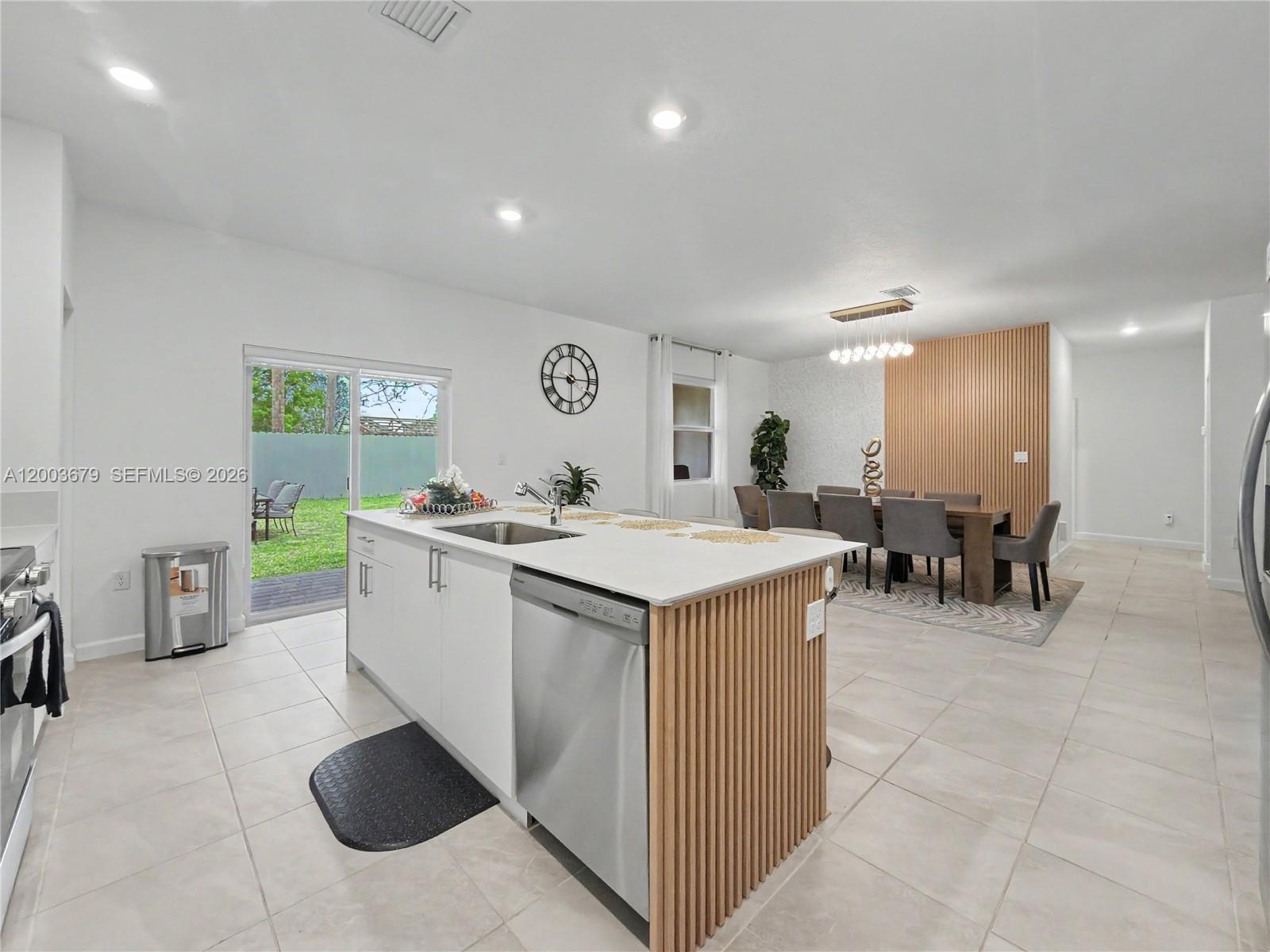 13218 Southwest 189th Terrace Miami, FL 33177 - Photo 22 of 47 a kitchen with a sink and counter top space
