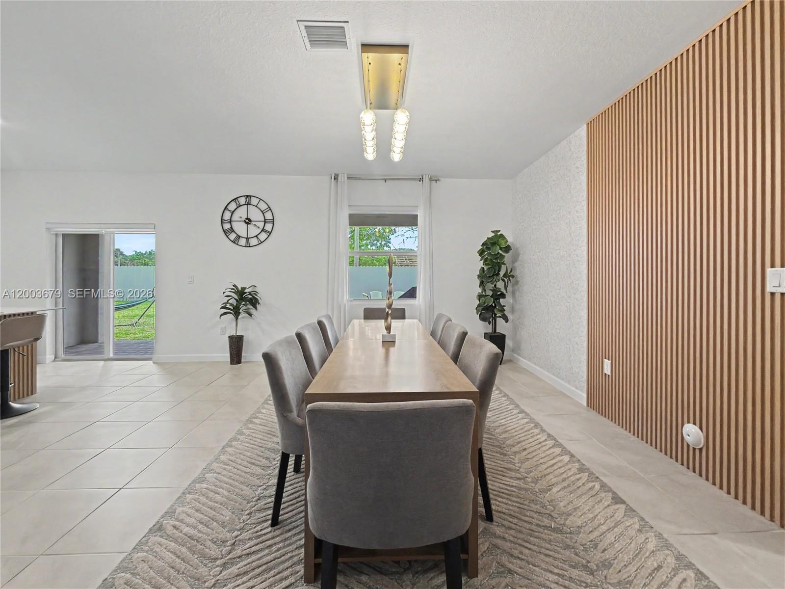 13218 Southwest 189th Terrace Miami, FL 33177 - Photo 25 of 47 a view of a dining room with furniture and wooden floor