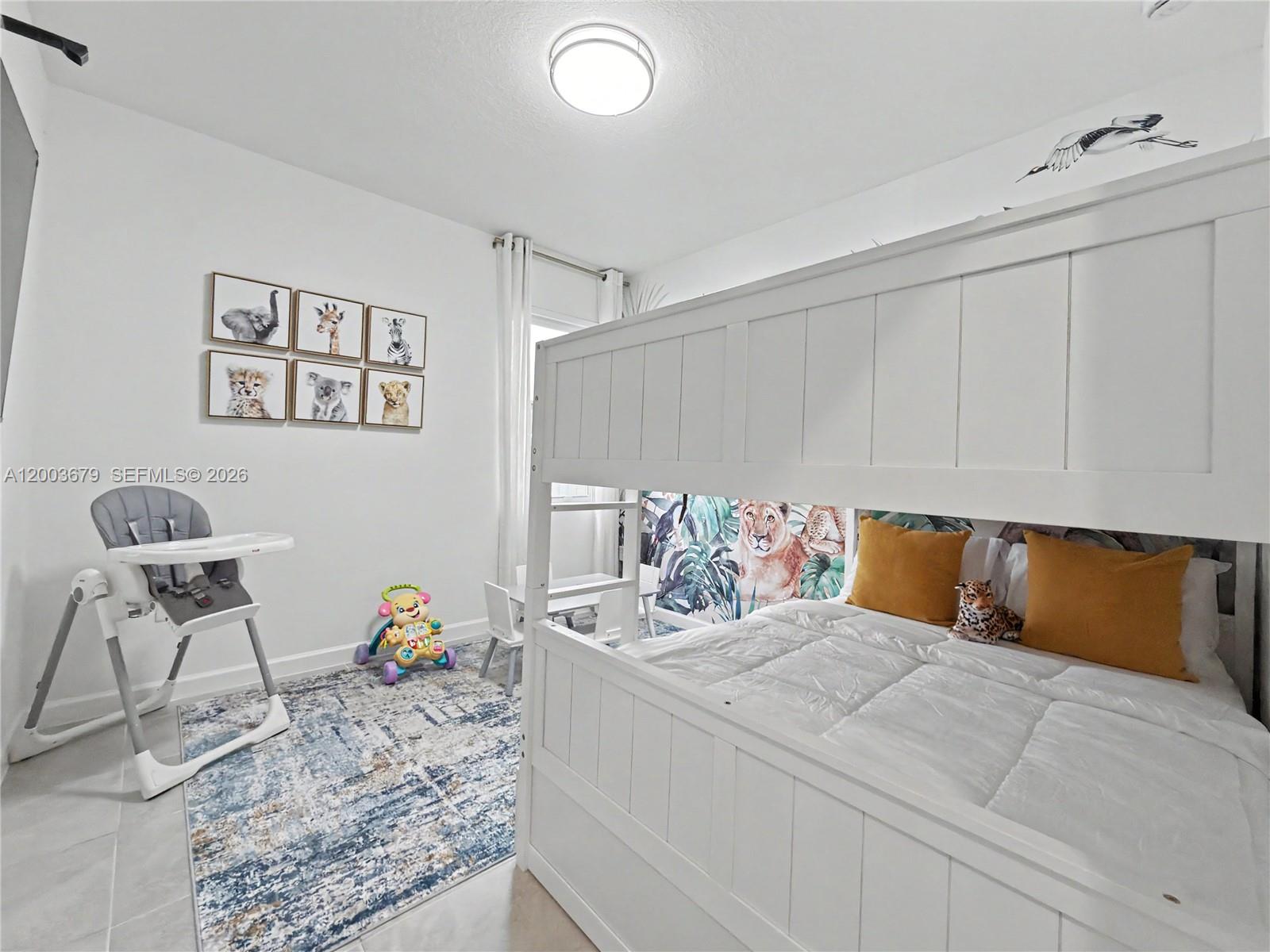 13218 Southwest 189th Terrace Miami, FL 33177 - Photo 26 of 47 a bedroom with a bed and wooden floor