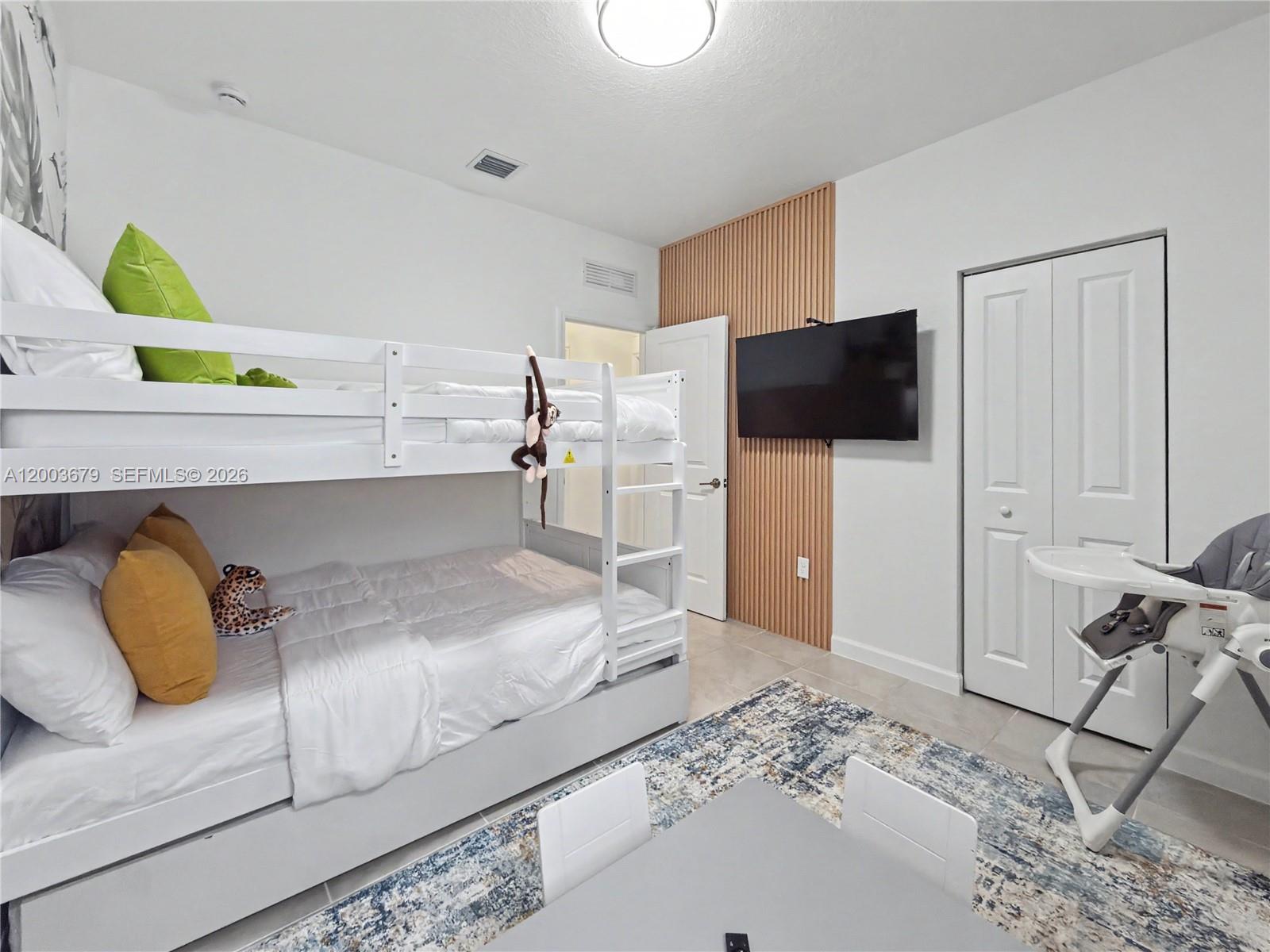 13218 Southwest 189th Terrace Miami, FL 33177 - Photo 28 of 47 a bedroom with a bed and a couch
