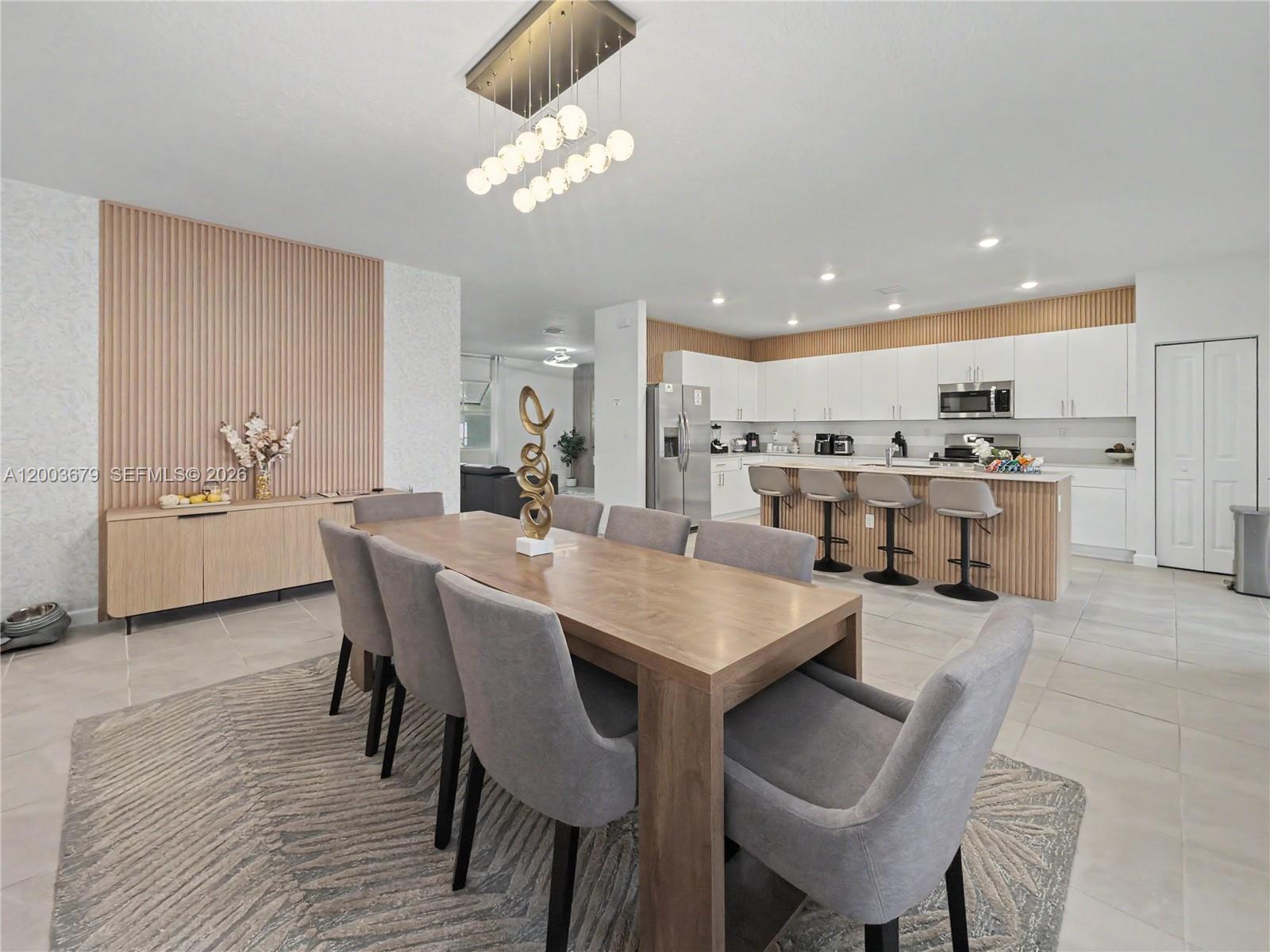 13218 Southwest 189th Terrace Miami, FL 33177 - Photo 3 of 47 a large kitchen with a table and chairs