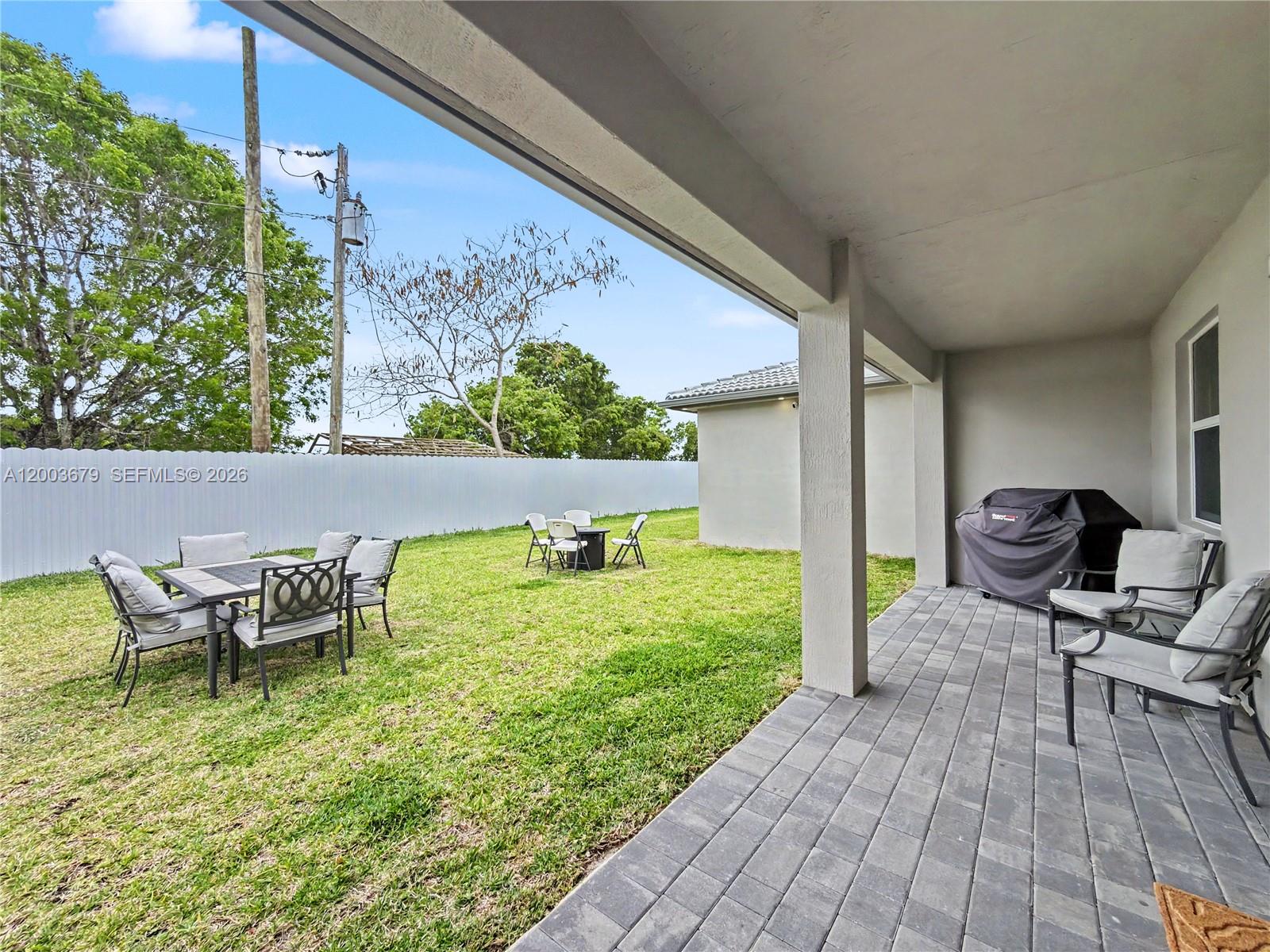 13218 Southwest 189th Terrace Miami, FL 33177 - Photo 40 of 47 a view of a chairs and table in patio of the house