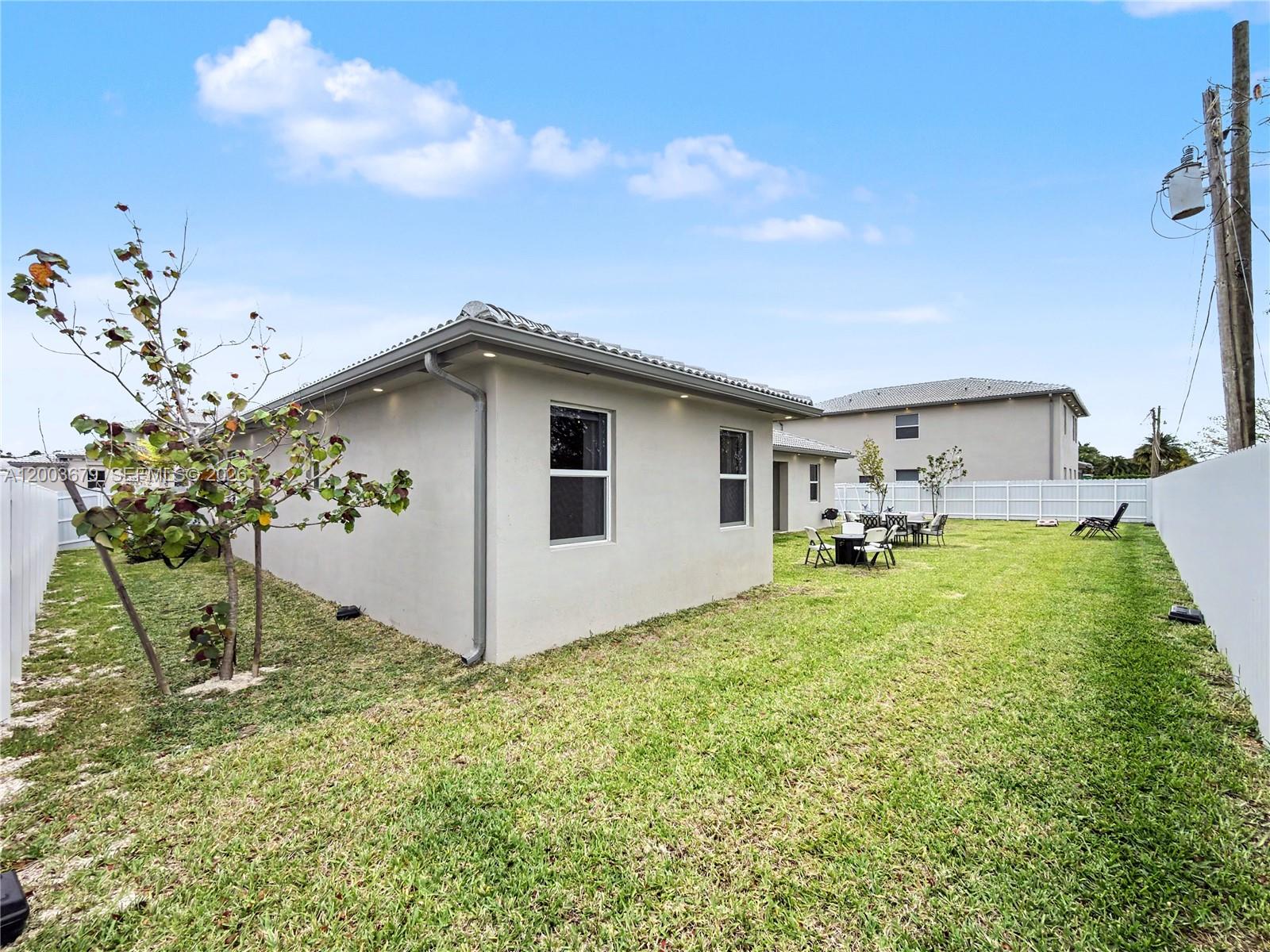 13218 Southwest 189th Terrace Miami, FL 33177 - Photo 43 of 47 a view of a house with backyard