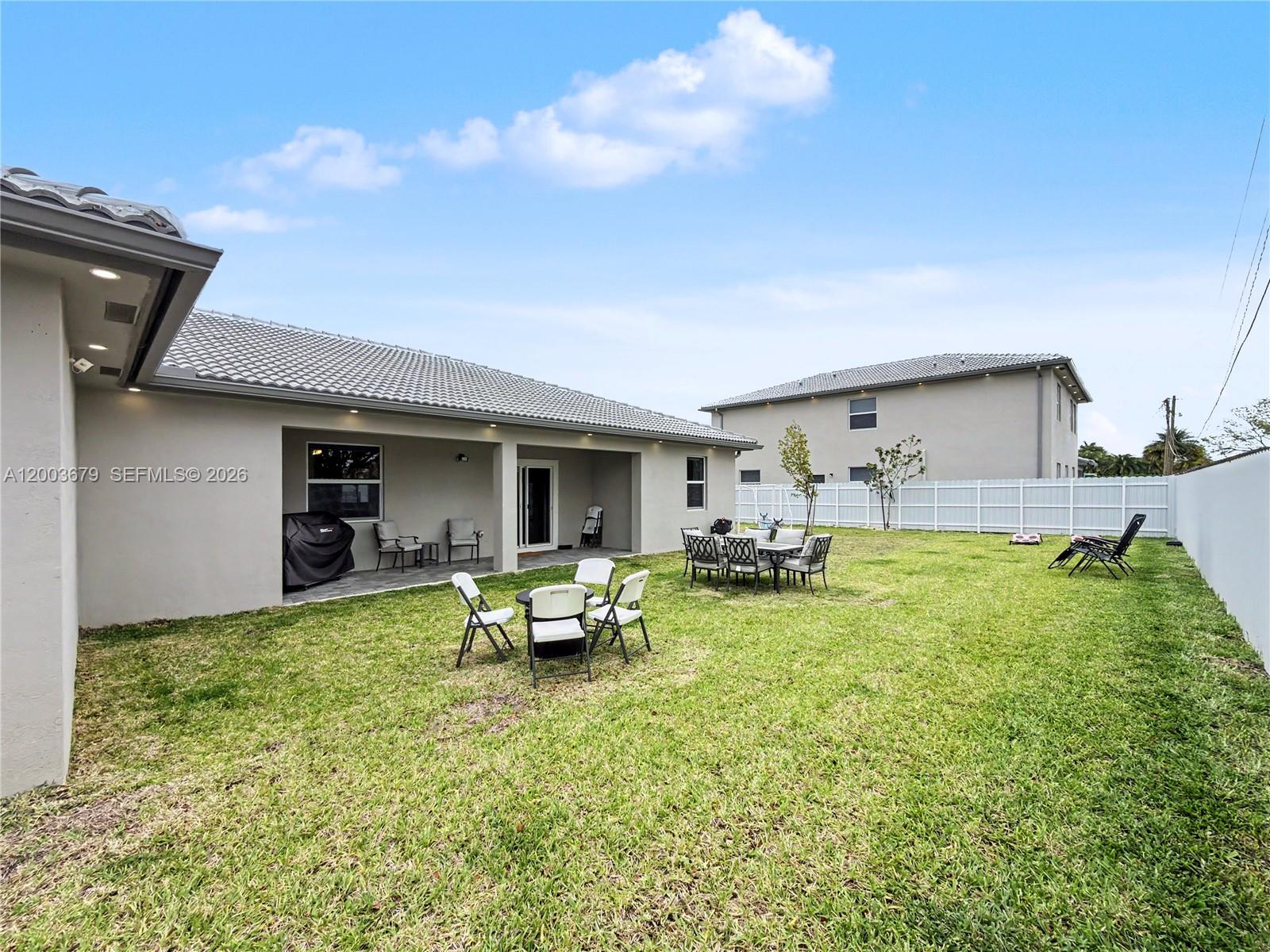 13218 Southwest 189th Terrace Miami, FL 33177 - Photo 44 of 47 a view of a house with backyard porch and furniture