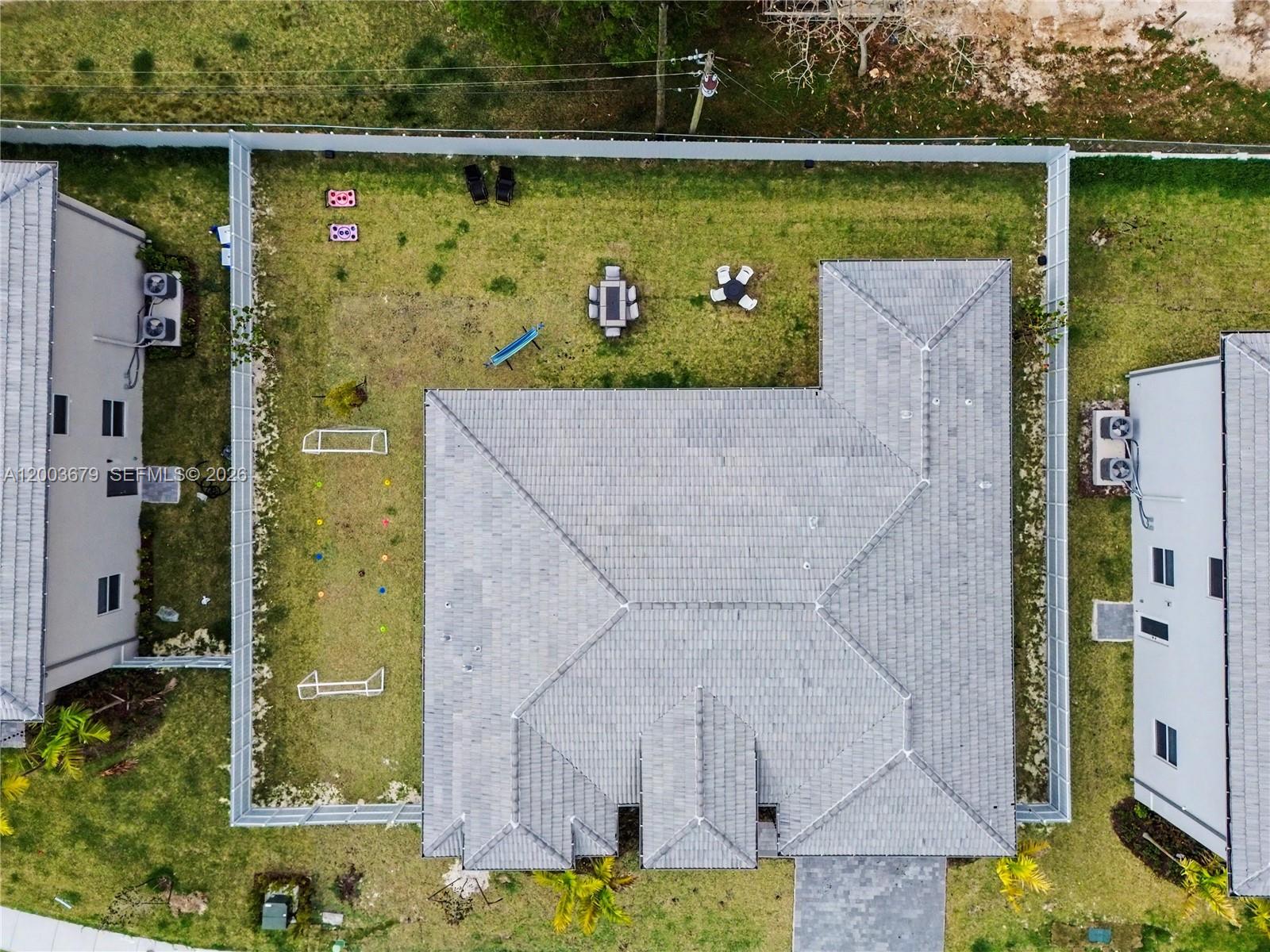 13218 Southwest 189th Terrace Miami, FL 33177 - Photo 46 of 47 an aerial view of a house with a yard