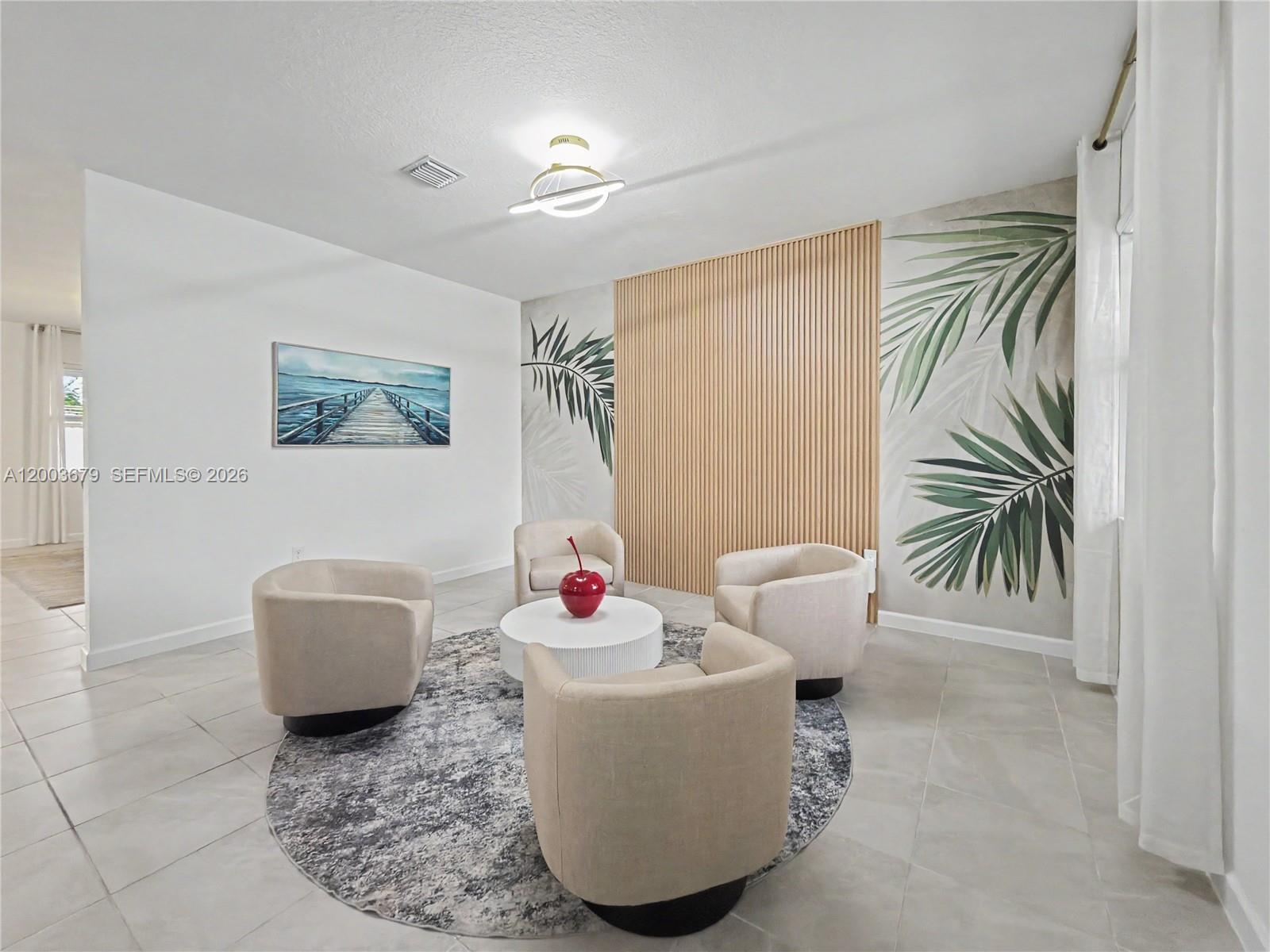 13218 Southwest 189th Terrace Miami, FL 33177 - Photo 7 of 47 a living room with furniture and a potted plant